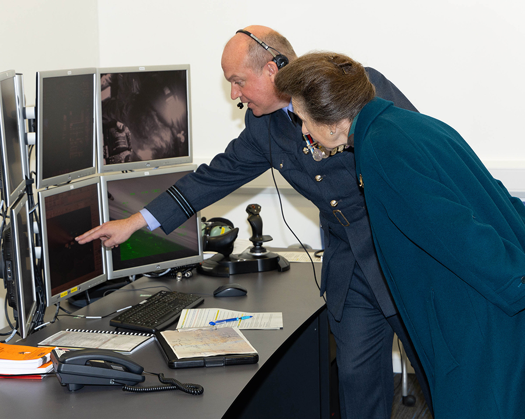 Her Royal Highness, The Princess Royal is introduced to one of the Squadron's training facilities.
